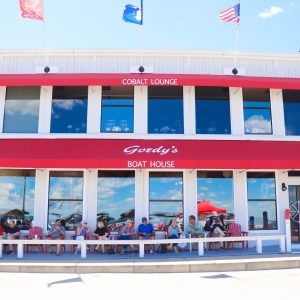 Gordy's Boathouse Restaurant and Bar with people dining on an outside patio