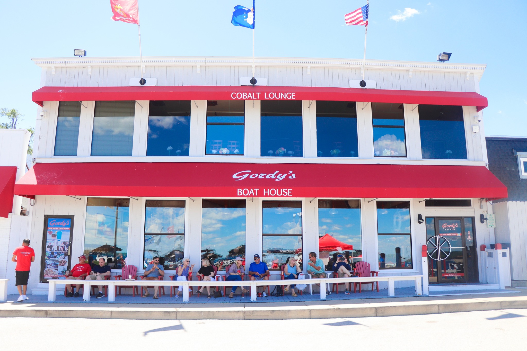 Gordy's Boathouse Restaurant and Bar with people dining on an outside patio